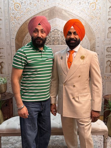 Orange and rose pink wedding turbans tied for guests